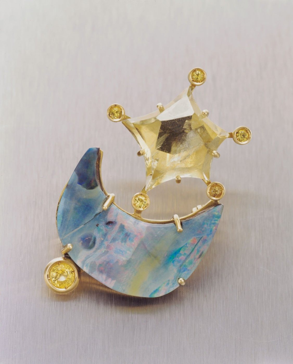 A moon brooch in citrine and opal