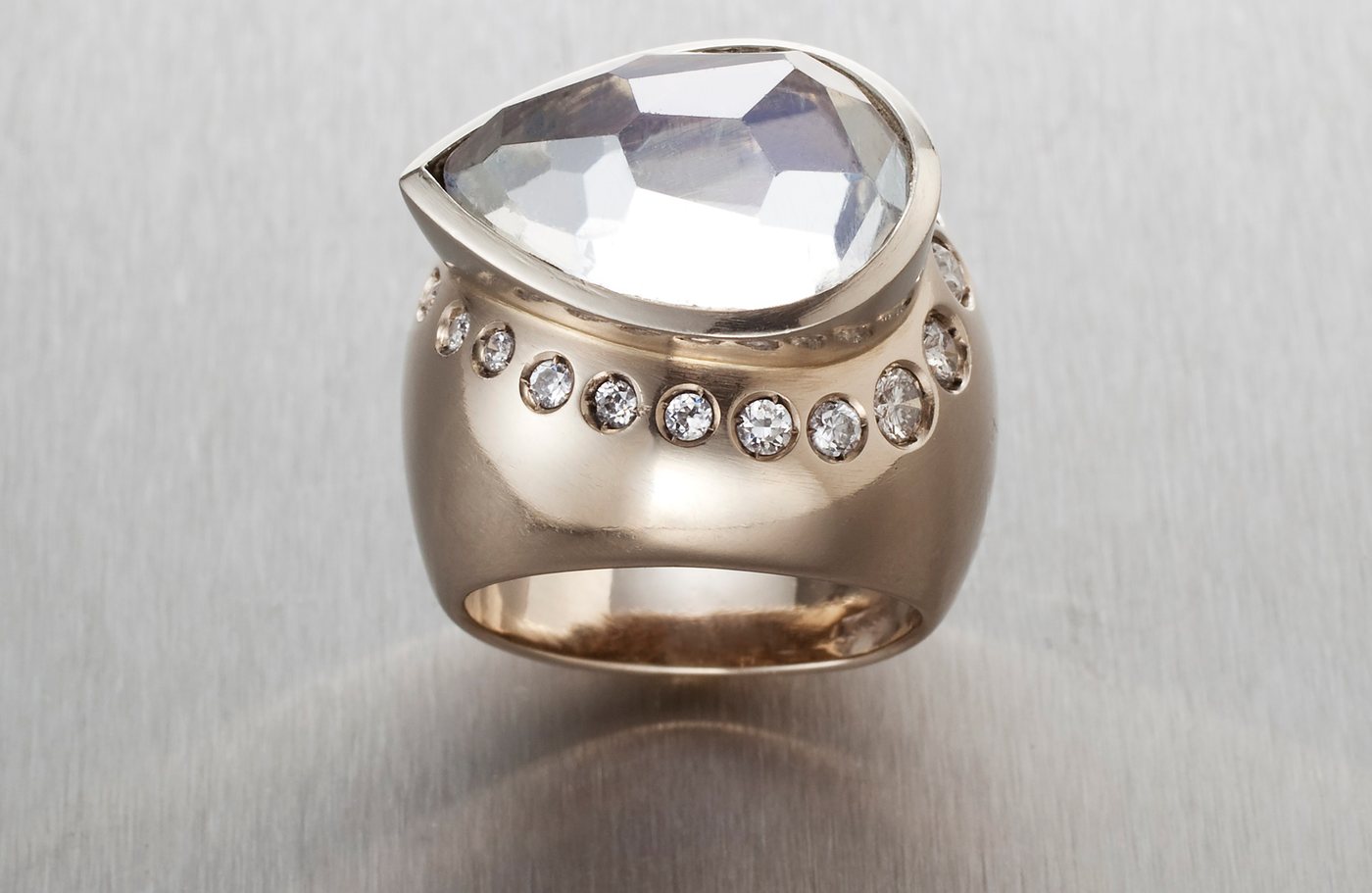 A silver ring set with a pale stone