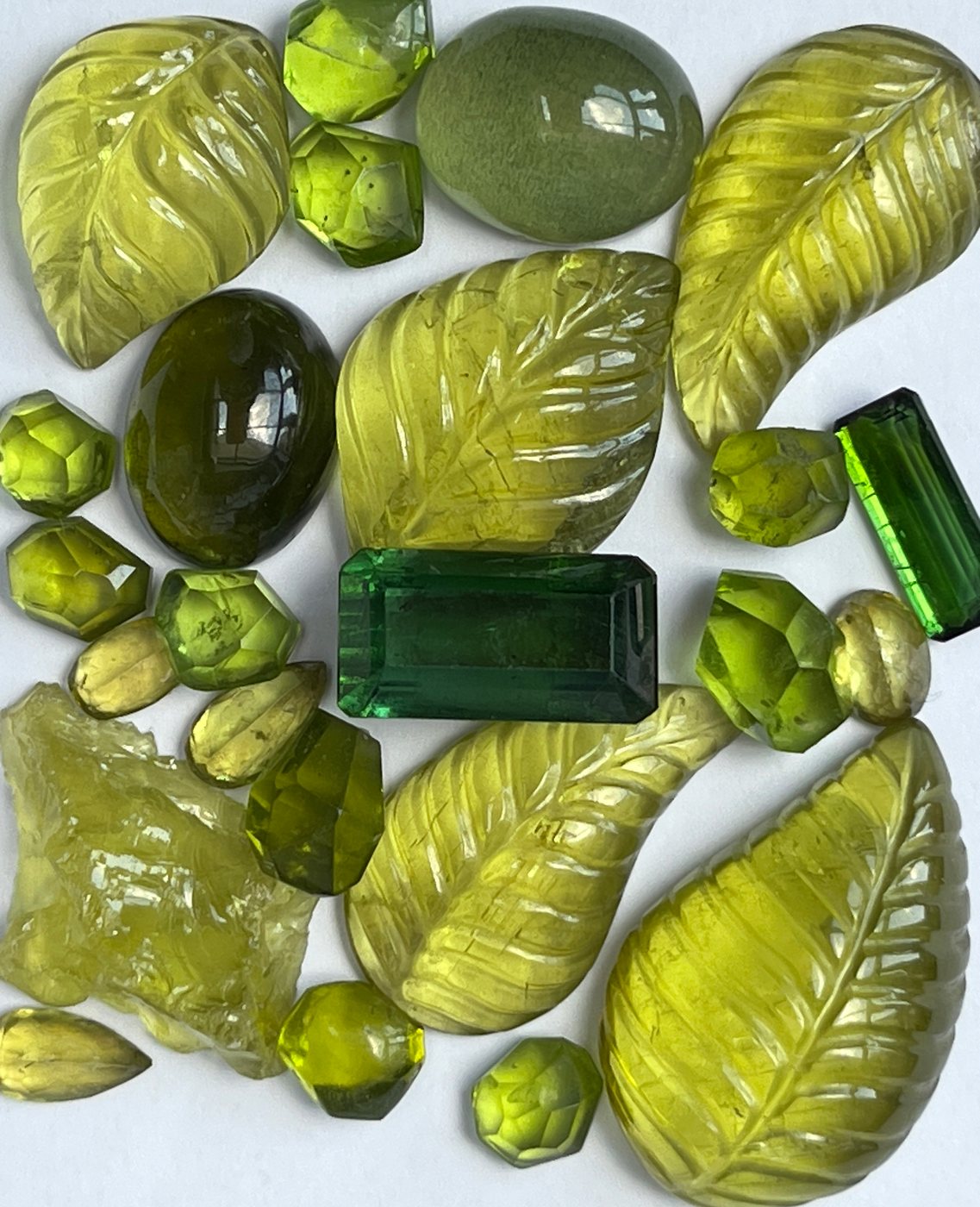 Green stones, cut and rough