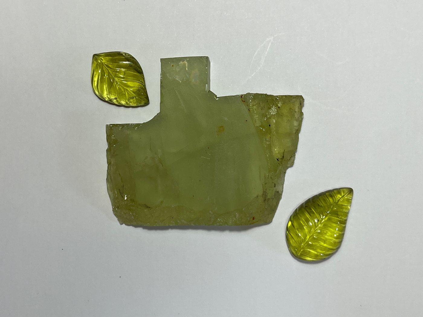 A carved green leaf, unset