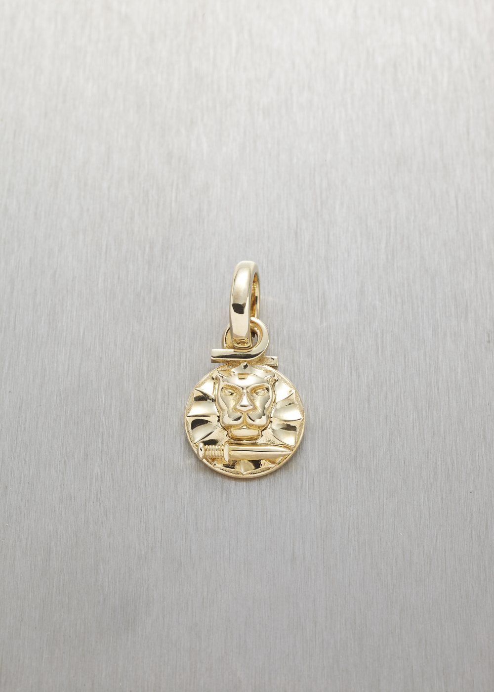 A Betoken pendant in yellow gold