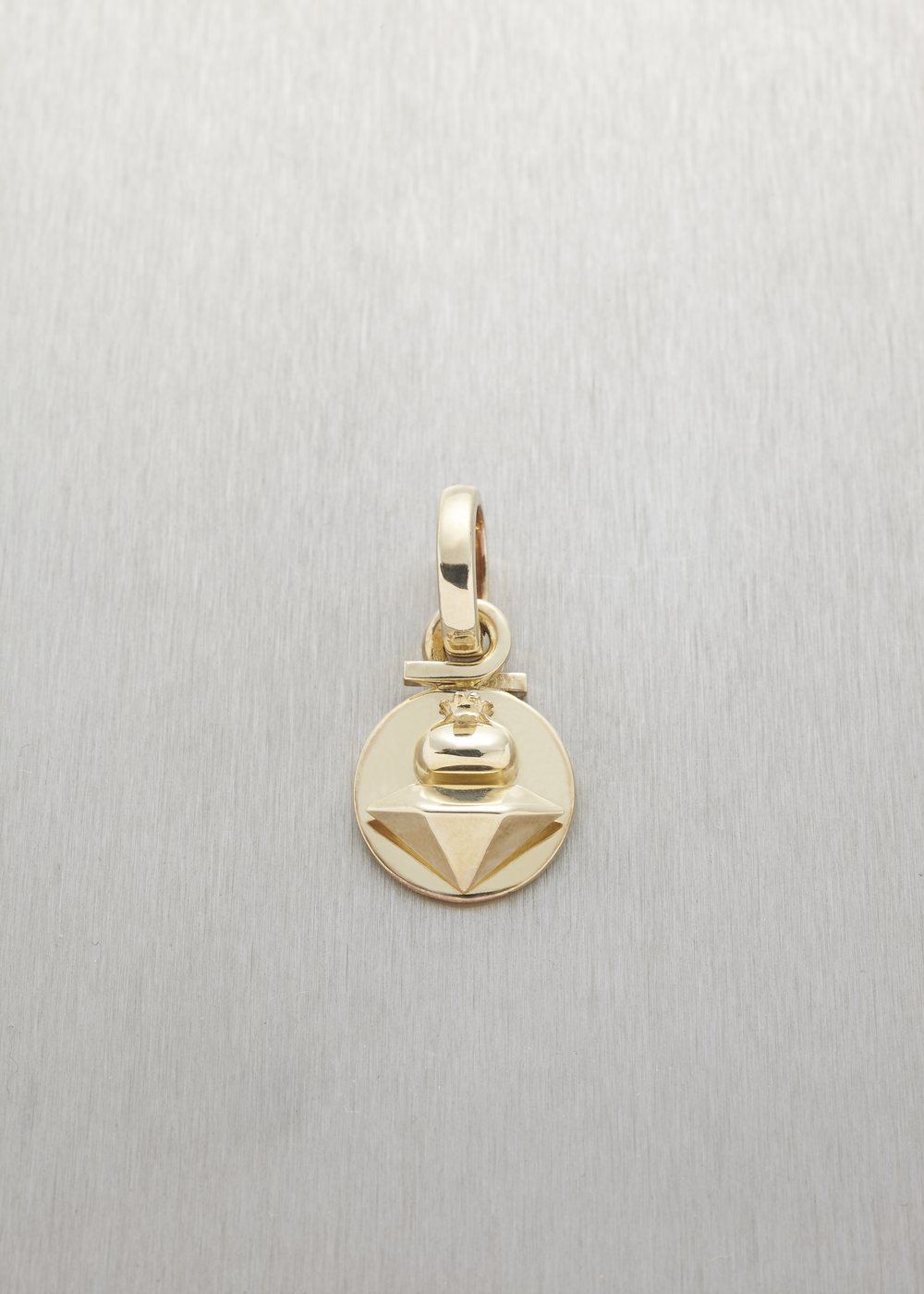 A Betoken pendant in yellow gold