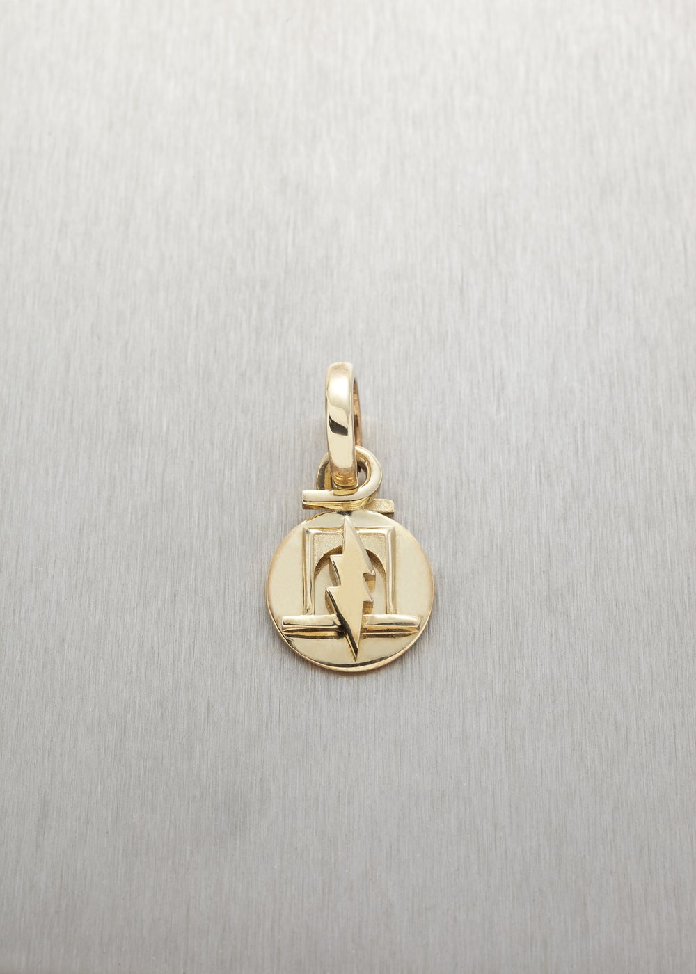 A Betoken pendant in yellow gold