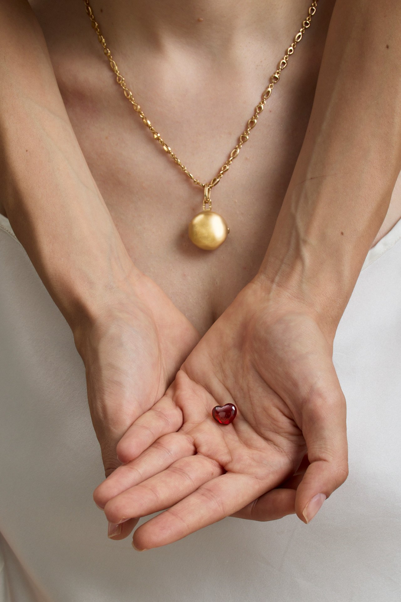 A Tra Noi locket worn